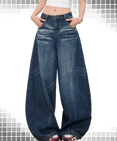 Baggy scimitar-style dark
vintage coloured washed jeans