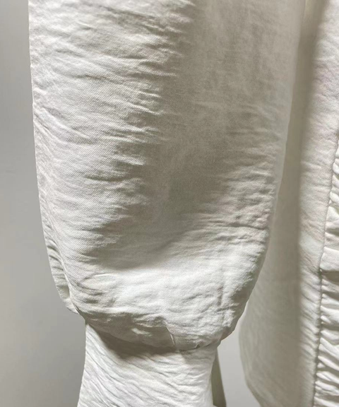 Long-sleeved white linen shirt dress