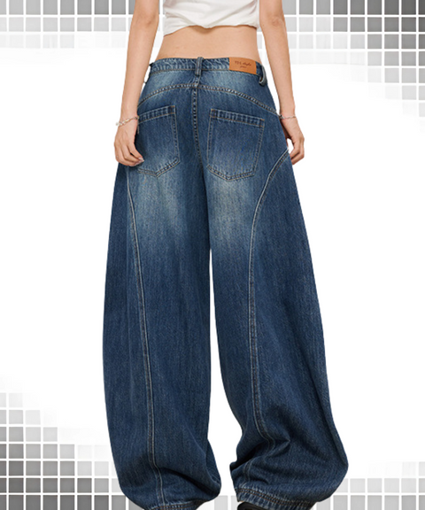 Baggy scimitar-style dark
vintage coloured washed jeans